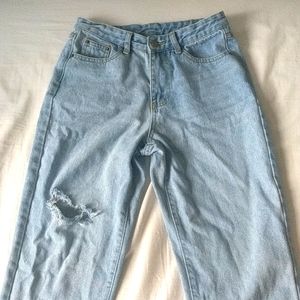 Distressed light washed blue high waisted jeans